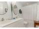 Bright bathroom featuring dual sinks, decorative mirrors, and stylish fixtures providing elegance and functionality at 457 Poplar Forest Ln, Pittsboro, NC 27312