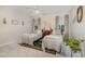 Bright and airy bedroom featuring twin beds, soft lighting, and a calming color scheme at 457 Poplar Forest Ln, Pittsboro, NC 27312