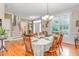 Elegant dining room featuring hardwood floors, chandelier, and traditional furnishings at 457 Poplar Forest Ln, Pittsboro, NC 27312