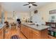 Open kitchen with a large island, stainless appliances and convenient access to the dining area at 457 Poplar Forest Ln, Pittsboro, NC 27312