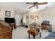 Inviting living room boasts natural light, comfortable seating, and classic decor, creating a welcoming atmosphere at 457 Poplar Forest Ln, Pittsboro, NC 27312