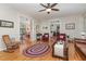 Bright living room with hardwood floors, ample seating and views into other living areas at 457 Poplar Forest Ln, Pittsboro, NC 27312