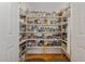 Walk-in pantry with ample shelving and storage, perfect for keeping your kitchen organized at 457 Poplar Forest Ln, Pittsboro, NC 27312