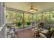 Relaxing screened porch with comfortable seating and peaceful views of the surrounding nature at 457 Poplar Forest Ln, Pittsboro, NC 27312