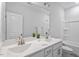 Well-lit bathroom featuring a double sink vanity with a soaking tub and shower at 4940 Enlightenment Rd, Raleigh, NC 27616