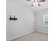 Empty bedroom has a ceiling fan and a large window at 4940 Enlightenment Rd, Raleigh, NC 27616