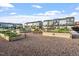 Community garden with raised garden beds surrounded by neighborhood townhomes at 4940 Enlightenment Rd, Raleigh, NC 27616