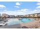 Resort style community pool with plenty of lounge chairs and beautiful views of the neighborhood at 4940 Enlightenment Rd, Raleigh, NC 27616