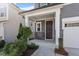 Cozy front porch with stone accents and well-maintained landscaping at 4940 Enlightenment Rd, Raleigh, NC 27616