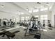 Bright gym featuring modern equipment, large mirrors and plenty of natural light at 4940 Enlightenment Rd, Raleigh, NC 27616