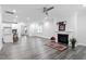 Open concept living room has a fireplace and adjoins the modern kitchen at 4940 Enlightenment Rd, Raleigh, NC 27616