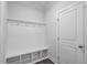 Mudroom area with bench, storage cubbies and coat hooks at 4940 Enlightenment Rd, Raleigh, NC 27616