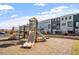 Community playground with slides, climbing structures, and soft ground surface at 4940 Enlightenment Rd, Raleigh, NC 27616