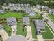 Aerial view of a two-story home with well-manicured lawn in a residential neighborhood at 504 Gumview Cir, Fuquay Varina, NC 27526