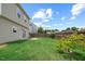 A spacious back yard features a green lawn and a wooden privacy fence at 504 Gumview Cir, Fuquay Varina, NC 27526