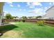 A green back yard has a patio and a wood privacy fence at 504 Gumview Cir, Fuquay Varina, NC 27526