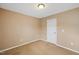 Neutral bedroom with carpet and a white door at 504 Gumview Cir, Fuquay Varina, NC 27526