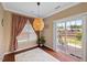 Inviting dining area features hardwood floors, and sliding glass doors with a backyard view at 504 Gumview Cir, Fuquay Varina, NC 27526