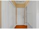 Hallway featuring a white door, white closet doors, and dark wood floors at 504 Gumview Cir, Fuquay Varina, NC 27526