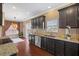 Kitchen area featuring dark wood cabinets, stainless steel appliances, and granite countertops at 504 Gumview Cir, Fuquay Varina, NC 27526
