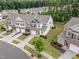 Aerial view of townhomes with well-maintained lawns, mature trees, and neatly arranged driveways at 515 Historic Dr, Hillsborough, NC 27278