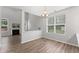 Bright dining area with hardwood floors, chandelier, and natural light at 515 Historic Dr, Hillsborough, NC 27278