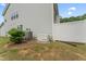 Home exterior showcasing the generator and white privacy fence at 515 Historic Dr, Hillsborough, NC 27278