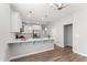 Bright kitchen featuring white cabinets, stainless steel appliances and eat-in breakfast bar at 515 Historic Dr, Hillsborough, NC 27278