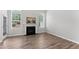 Inviting living room with fireplace, natural light, and neutral decor at 515 Historic Dr, Hillsborough, NC 27278