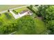 Aerial view shows a large, tree-lined property with mature trees and expansive lawn at 541 Mallie Pearce Rd, Zebulon, NC 27597