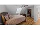 Bedroom with wood floors, a bed, a ceiling fan and a bookcase at 541 Mallie Pearce Rd, Zebulon, NC 27597