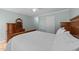 Cozy bedroom featuring a wooden sleigh bed, dresser, ceiling fan, and natural light at 541 Mallie Pearce Rd, Zebulon, NC 27597