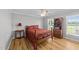 Bedroom featuring wooden floors, a ceiling fan, a bed, and natural light at 541 Mallie Pearce Rd, Zebulon, NC 27597