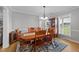 Elegant dining room featuring a large table, chairs, and hardwood floors, perfect for gatherings at 541 Mallie Pearce Rd, Zebulon, NC 27597