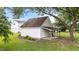 View of detached two-car garage with covered lean-to area perfect for equipment storage at 541 Mallie Pearce Rd, Zebulon, NC 27597