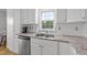 Kitchen features granite countertops, stainless steel appliances, and a window above the sink at 541 Mallie Pearce Rd, Zebulon, NC 27597