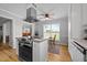 Open kitchen features an island with a cooktop and barstool seating, and a breakfast nook at 541 Mallie Pearce Rd, Zebulon, NC 27597