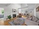 Spacious living room features high ceilings, a fireplace, hardwood floors, and comfortable seating at 541 Mallie Pearce Rd, Zebulon, NC 27597