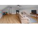 Bright living area offers a ceiling fan, comfortable seating, and natural light at 541 Mallie Pearce Rd, Zebulon, NC 27597