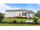 Rear exterior view highlighting the deck, enclosed porch, and fenced yard, creating a private oasis at 541 Mallie Pearce Rd, Zebulon, NC 27597