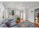 Well-lit sunroom with a ceiling fan, windows, and a door leading to the outside at 541 Mallie Pearce Rd, Zebulon, NC 27597