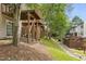 View of backyard area that features a creek, trees, and multi-level wooden decks at 5545 Crabtree Park Ct, Raleigh, NC 27612