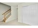 Finished basement with a staircase, neutral walls, and large closet at 5545 Crabtree Park Ct, Raleigh, NC 27612