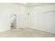 Bedroom featuring large closet and an entry door to a bathroom at 5545 Crabtree Park Ct, Raleigh, NC 27612