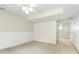Bedroom featuring carpet, neutral colored walls, and a view to the next room at 5545 Crabtree Park Ct, Raleigh, NC 27612