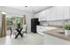 Bright kitchen with white cabinets, modern appliances, and an eat-in area at 5545 Crabtree Park Ct, Raleigh, NC 27612