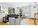 Comfortable living room with neutral colors, hardwood floors, and ample seating at 5545 Crabtree Park Ct, Raleigh, NC 27612
