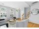 Bright living room featuring hardwood floors, arched windows, and stylish decor at 5545 Crabtree Park Ct, Raleigh, NC 27612