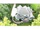 Beautiful aerial view showcasing the rear exterior with a patio and a circular driveway at 5920 Two Pines Trl, Wake Forest, NC 27587