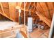 View of the unfinished attic of the home with wooden framing and ample storage space at 5920 Two Pines Trl, Wake Forest, NC 27587